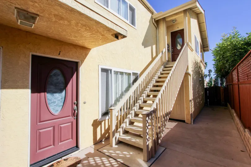 A two-storey residence in the 1912 Diamond community with an exterior staircase.
