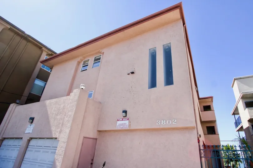A simple two-storey residence in 3802 Riviera Condos community covered in pinkish hue.