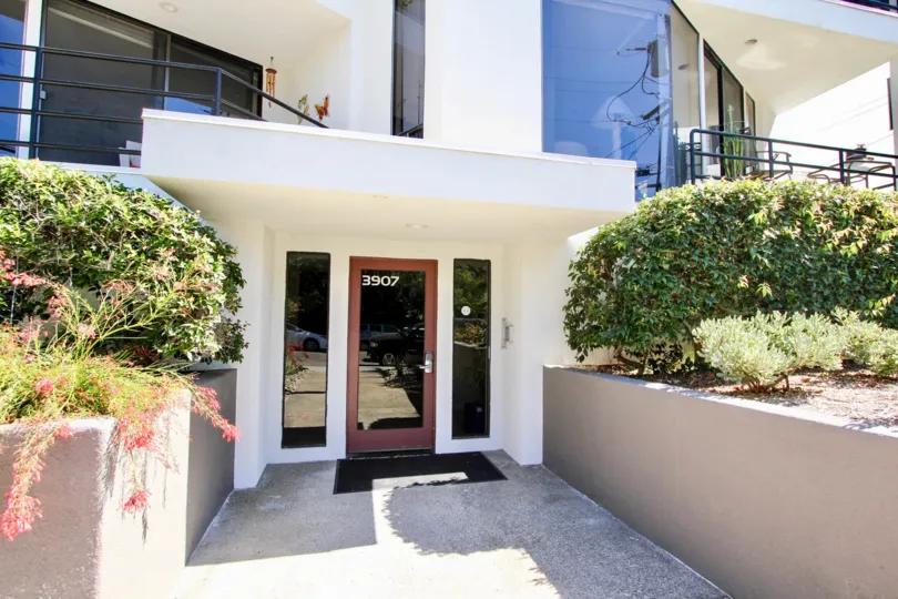 The pathway leading to the front door of 3907 Gresham Street apartments.