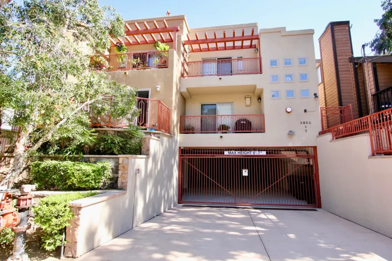 front view of a house in 3955 Gresham Condos, a very nice subtle look on a sunny day with greenery organised