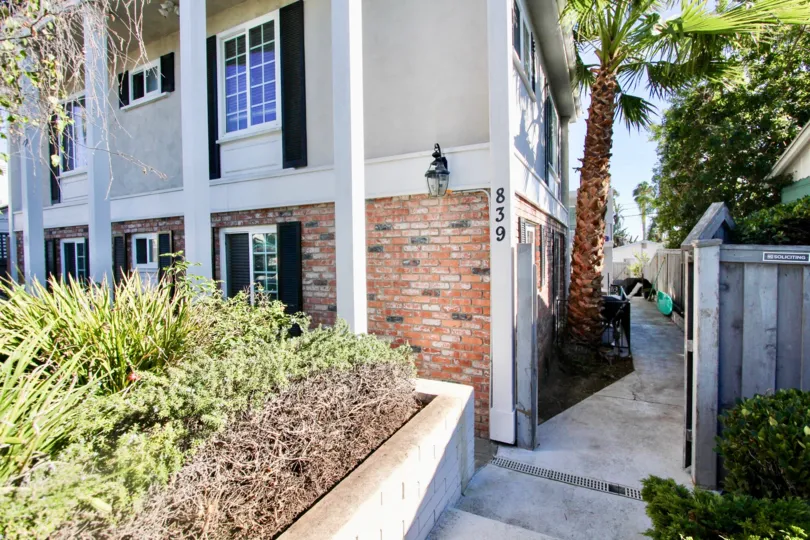 A sunny day with trees and House number shown in 839 Sapphire of Pacific Beach of California