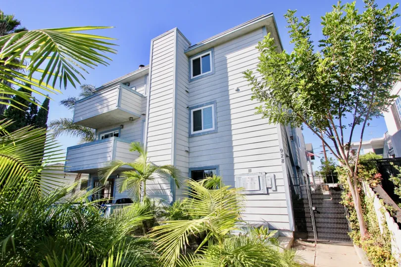 Sunny day front side view with trees of 928 Diamond, Pacific Beach, CA