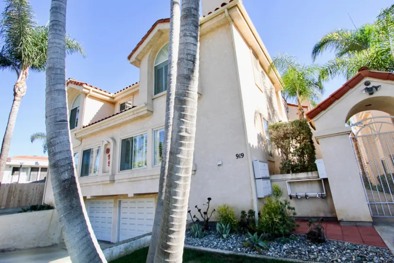 One of the two story properties in Agate Manor surrounded by palm trees