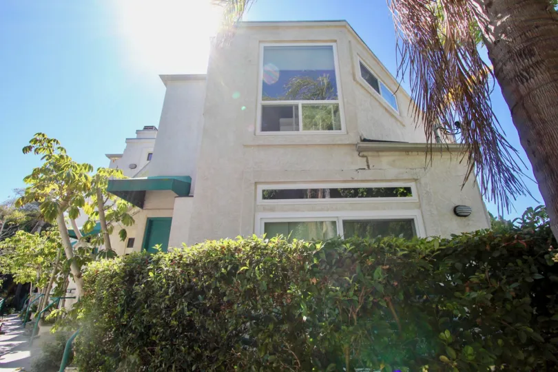 A sunny day in the area of Bay Walk, outside, trees, bushes, house, door