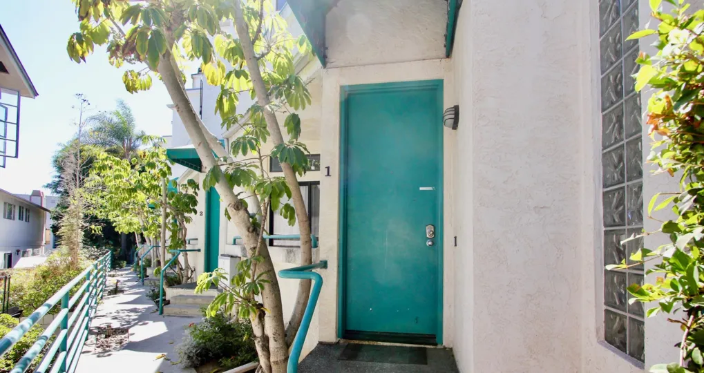 The turquoise door of an apartment in Pacific Beach, CA.