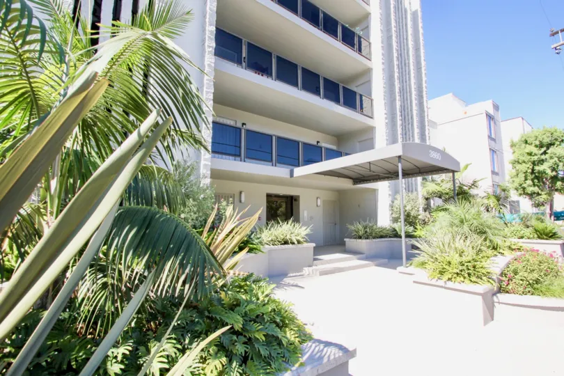Entrance to apartment building with awning at Baycliffs in Pacific Beach, Ca.