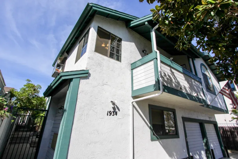 Twho-story gray house with corner windows at Baycrest in pacific Beach, California