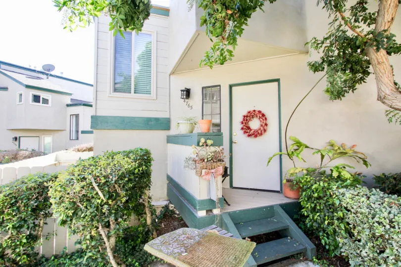 Entry door with a wreath to a unit at the Beach Scene in Pacific Beach, California