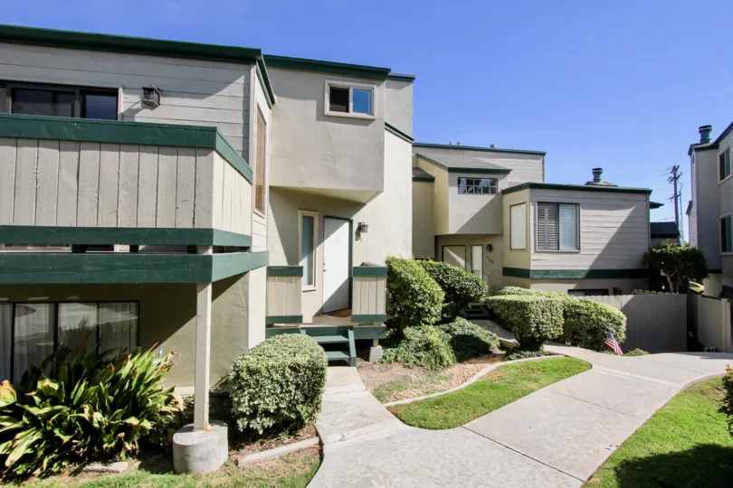 A sunny day in the area of Beach Scene, outside, garages, bushes, condos