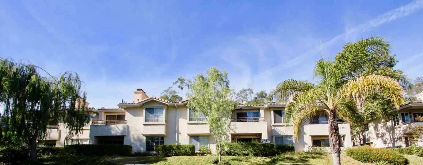 A sunny day in the area of Bella Pacific, outside, condos, palm trees, grass