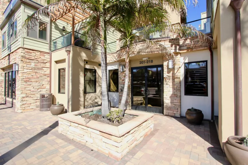 Our door patios on living quarters with sunshine and palm trees in Pacific Beach, California