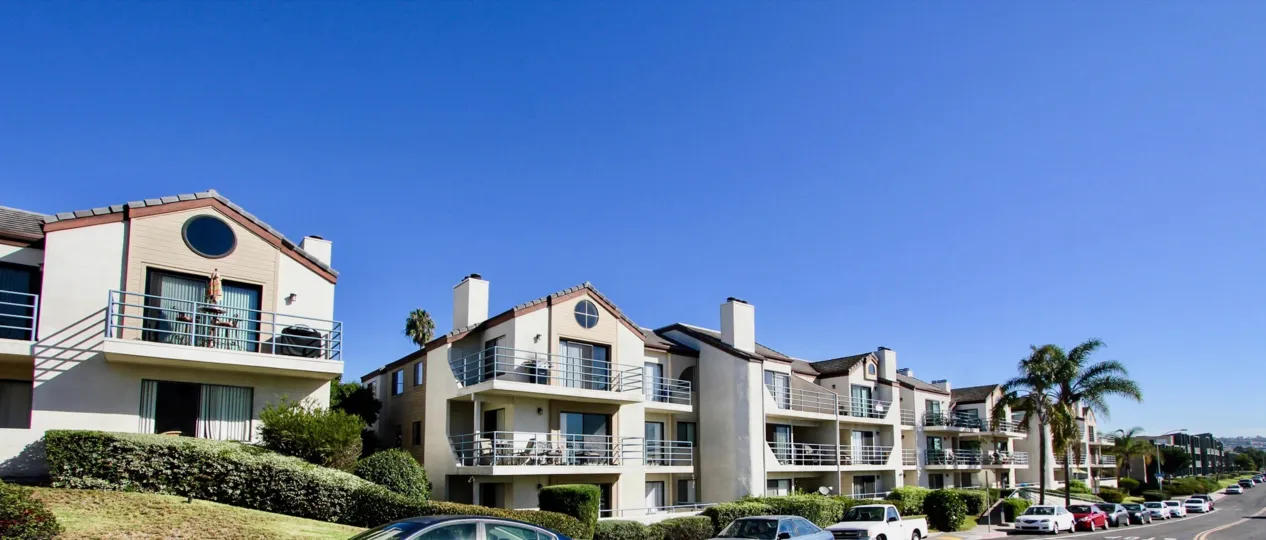 Front side road view of Camelot Bay community houses, Pacific Beach, CA