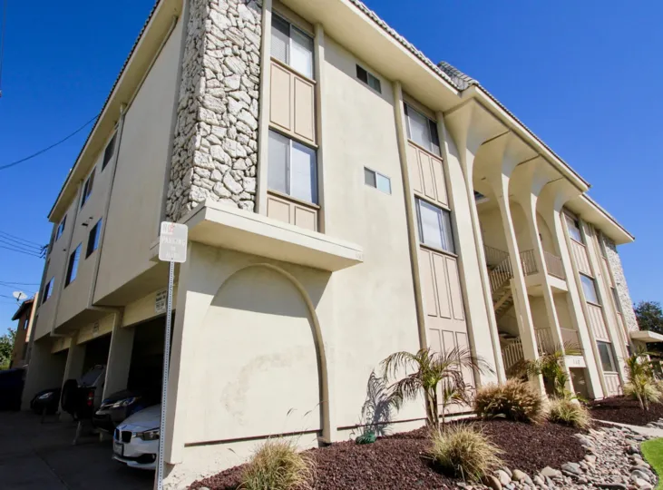 A residence with three-storey porch and ground level parking in the Camelot community.