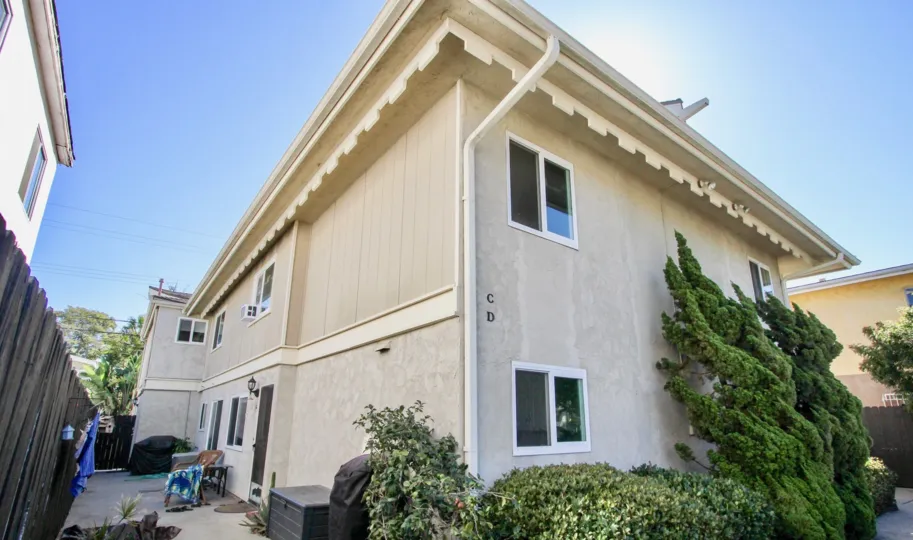 The outside of a home on a sunny day from Casas Crown Point in Pacific Beach, CA