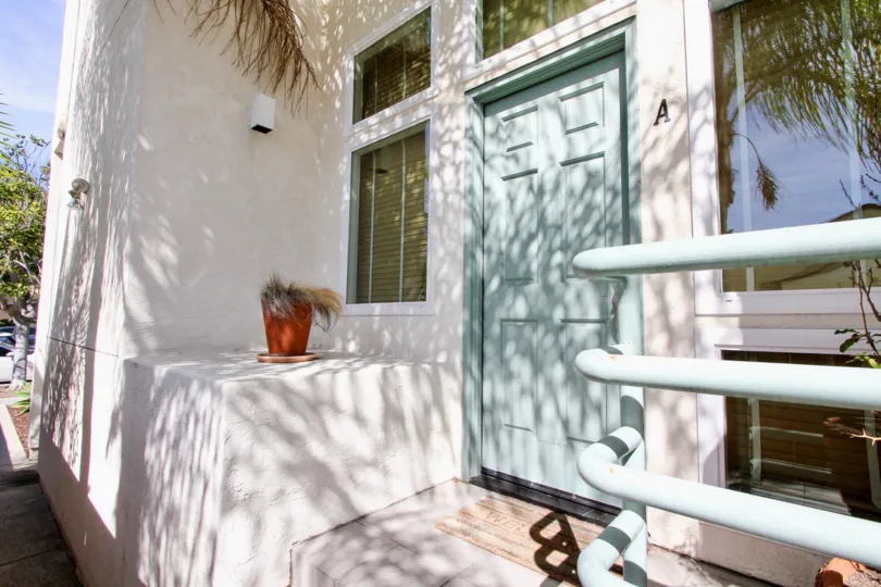 A teal door at the Chalcedony Townhomes of Pacific Beach, CA.