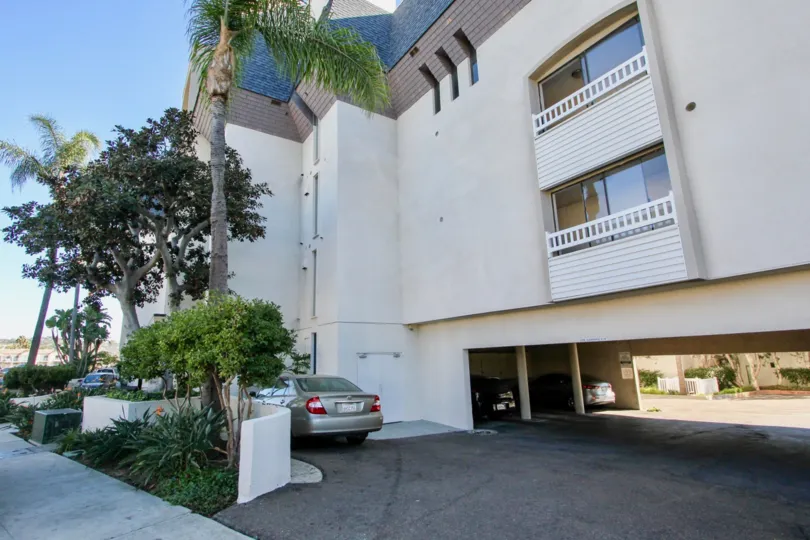 Apartment in Crown Point Villas has glass door balcony with trees and car parking facility