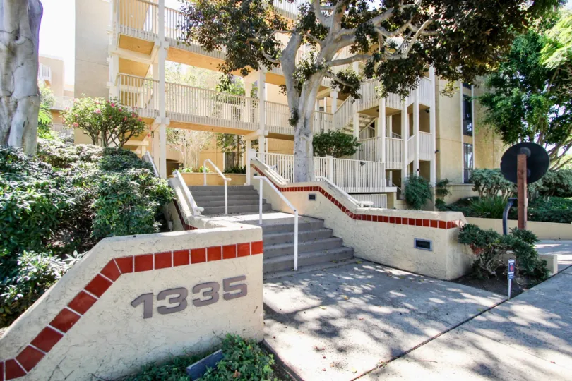 At Stair Wall painted with 1335 number with trees and plants in Gresham La Palma