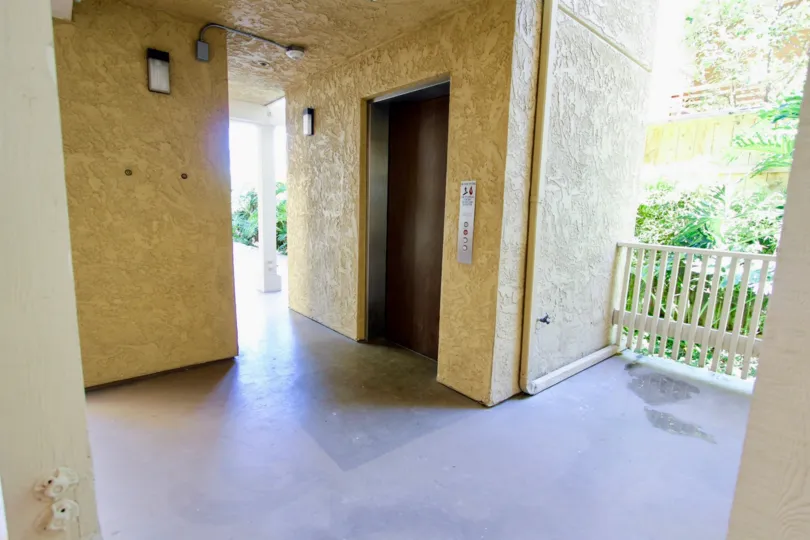 A beautiful yellow and wight color lift rest room in the Gresham La Palma near the balcony side.