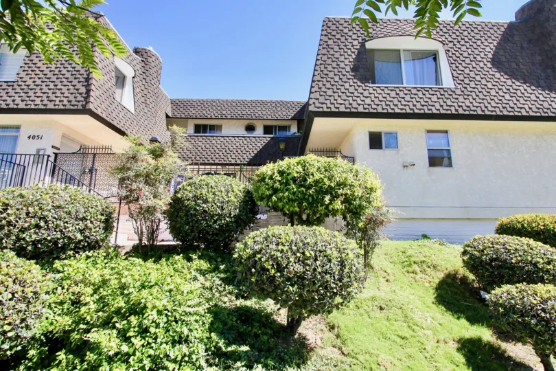 Two-storey residence in the Hemingway House community with brown roofing.