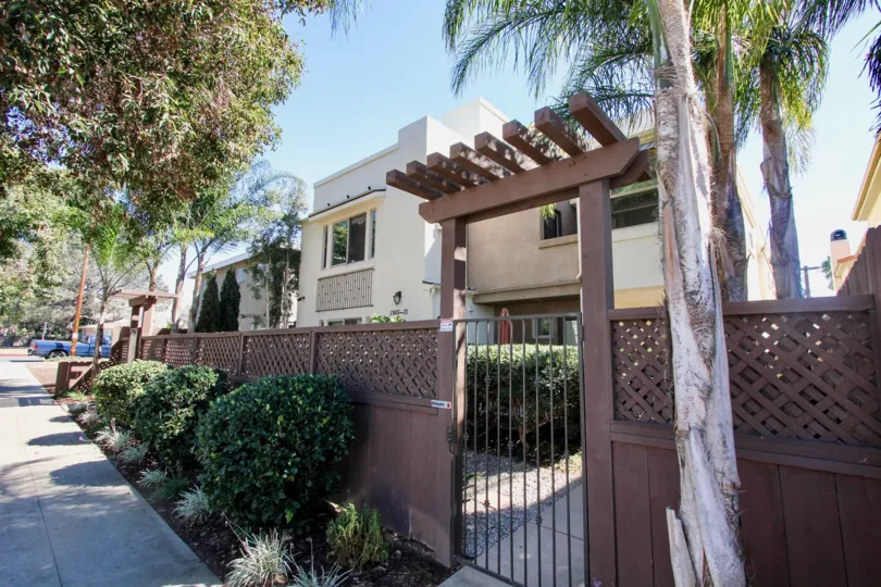 A sunny day in the area of Hornblend Townhomes, outside, gate, fence, condo