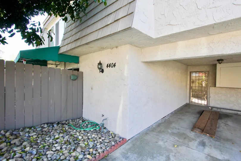 A sunny day in the area of La Casa Villa, wooden fence, outside, light, door, condo