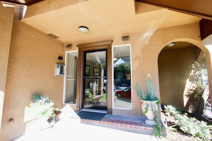 Sunny day of front entrance with intercom to La Jolla Bella, Pacific Beach, California