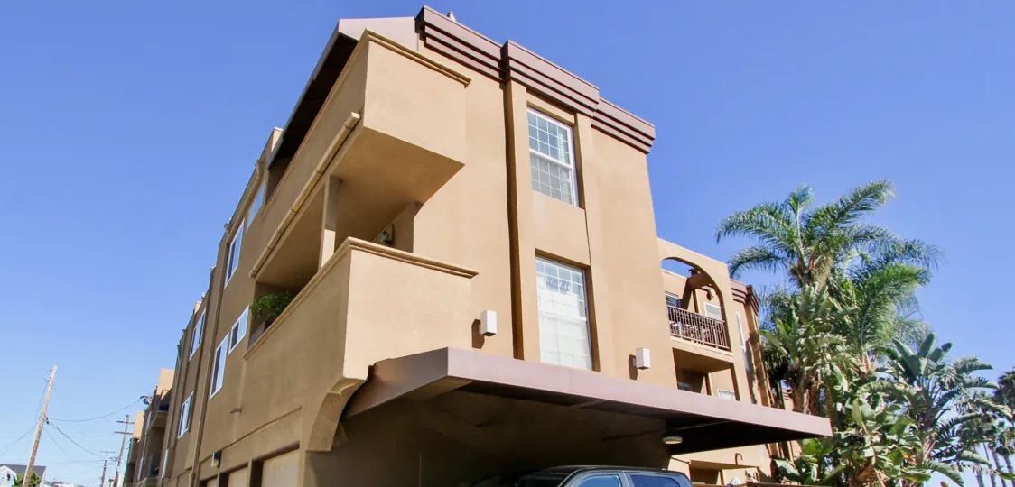 A three-storey residence with roofed parking in La Jolla Bella community.