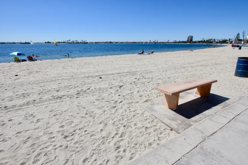 Peoples are sitting in chair and swimming in the sea water in Sunny day
