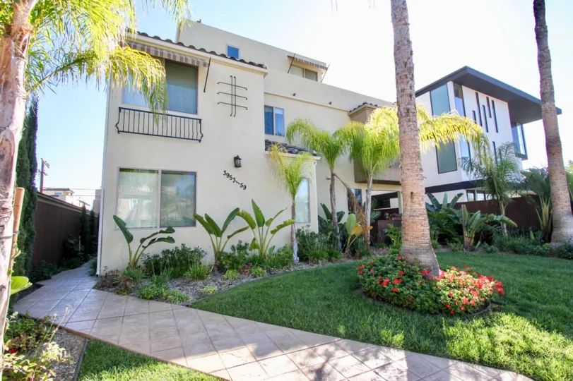 Multi-story townhome complex with beautiful landscaped exterior in Pacific Beach, California