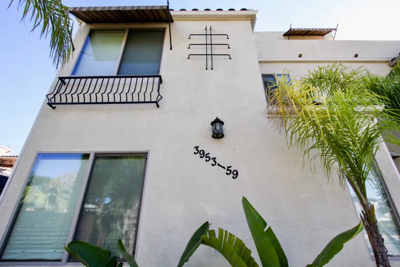 The apartment of 3953-59 in Lamont Street Townhomes has glass doors with plants