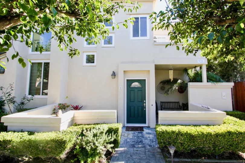 A residence looking building with a green door in Law Street community.