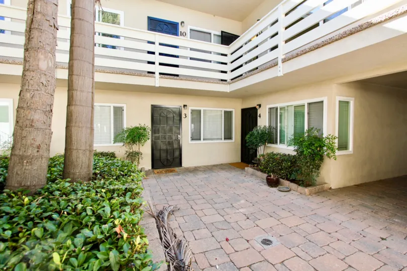 A simple paved courtyard in the Loring Manor community.