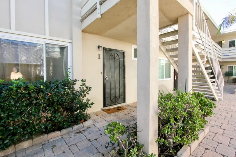 A Beautiful garden and stair case in front of a house in Loring Manor of Pacific Beach