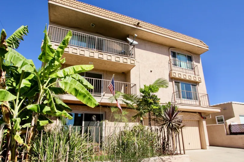 A sunny day in the area of Mission Bay Shores East, outside, american flag, balcony, condos