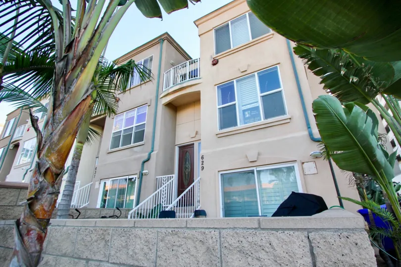 A sunny day in North Pacific Beach Row Homes with beautiful Grden and dates