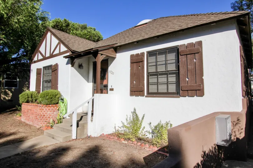 A house in Oliver Homes number with 1130 has bushes and plants