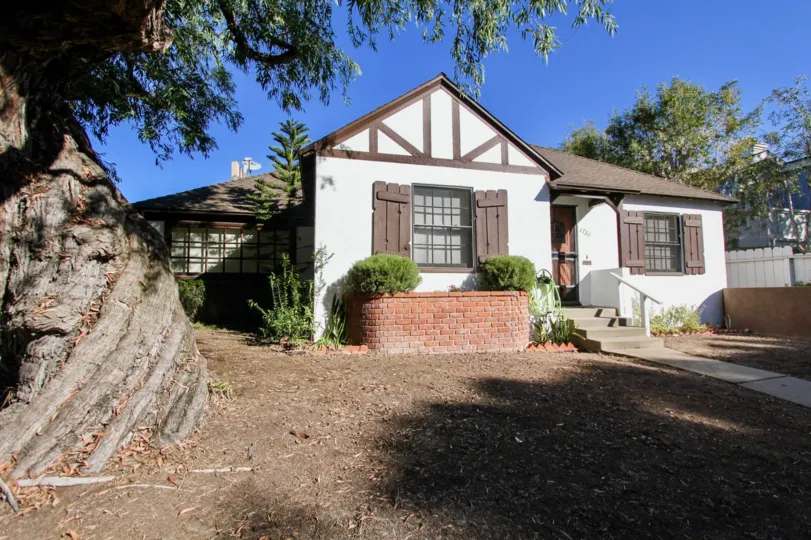 A sunny day in the area of Oliver Homes, outside, dirt, brick, house, sidewalk, door