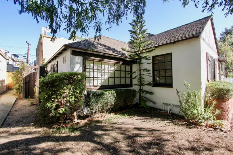 A bungalow with a sparse yard in the Oliver Homes community.