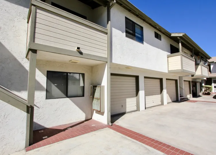 Bright sunny day with spacious villas with car parkings in Oliver Villas of Pacific Beach