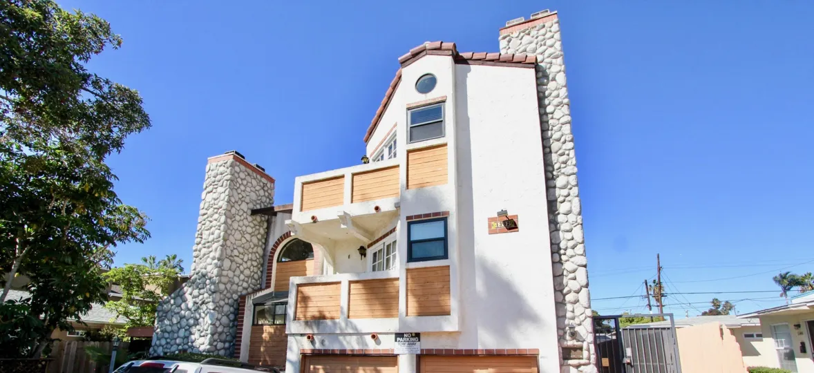 A traditional-style housing in the Pacific Gardens II community with stone cladding.