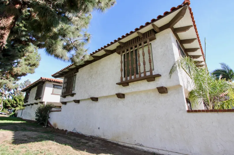 A two-storey residence in the Pacific Pines with decorative eaves and shutters.