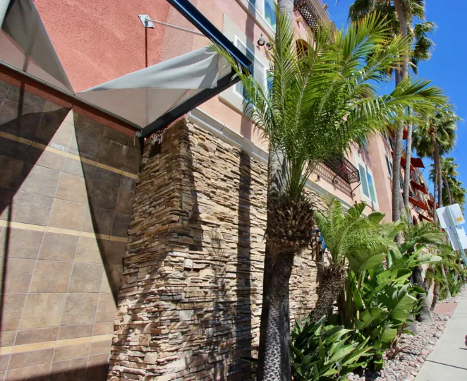 Tropical landscaping fills the planters in front of Pacific Shores