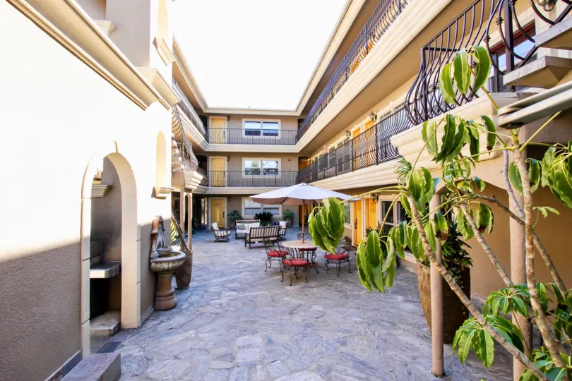 A sunny day in the area of Pacific Villas, outside, terrace, umbrella, fountain, table, balcony