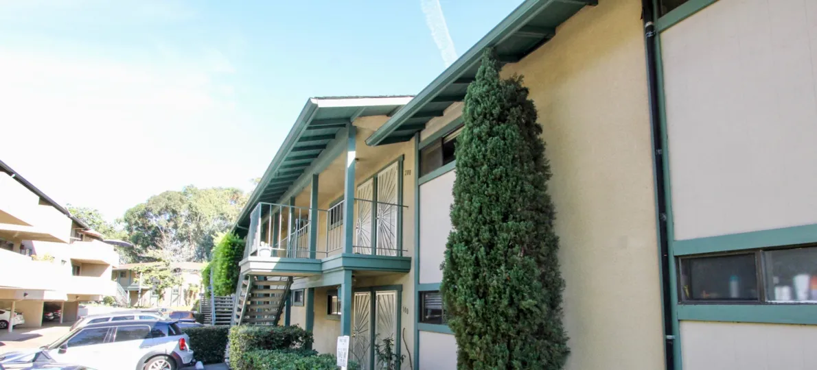 Spacious green coloured villas with trees and car parking in Pacific Woodlands in Pacific Beach
