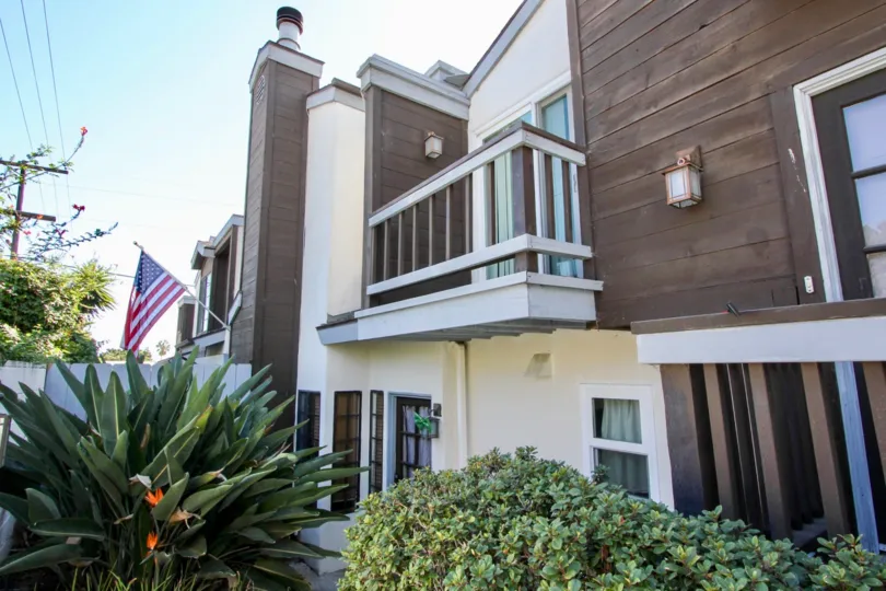 Beautiful view of a villa with USA Flag and garden around in Pacifica Townhomes of Pacific Beach