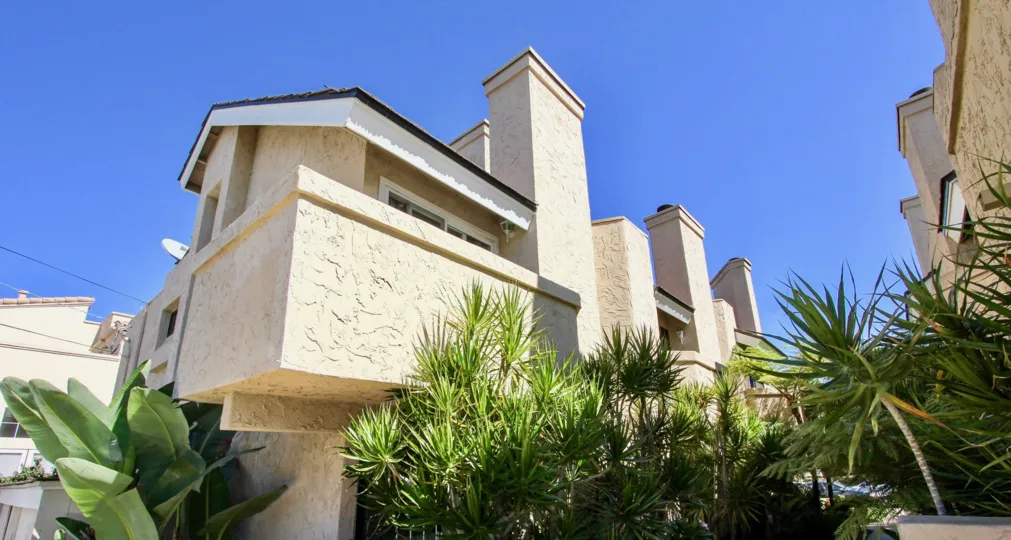 The Promontory Townhomes with many small plants around