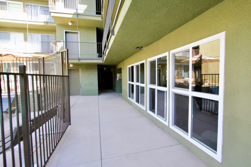 Beautiful entrance view of green colour villa in Regency Condos of Pacific Beach