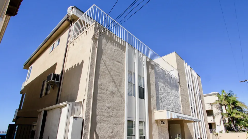 A modern townhouse with rooftop balcony in the Riviera Terrace community.