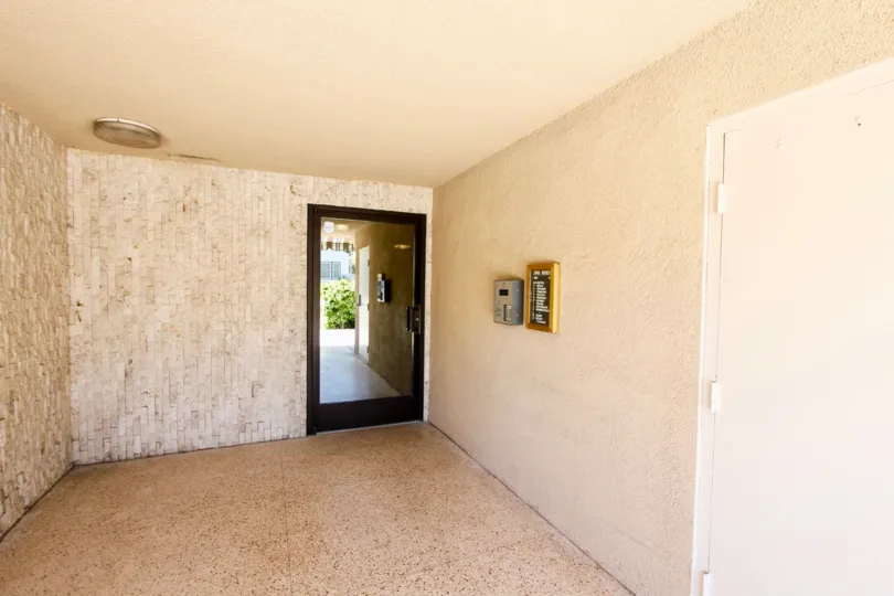 A room with entrance glass door inside a house in Riviera Terrace of Pacific Beach