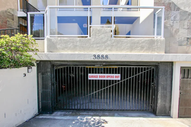 A sunny day in the area of Riviera Villas, outside, garage, gate, glass, trees